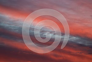 Dramatic colored patterns on clouds at sunset