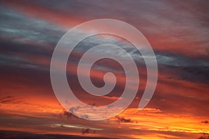 Dramatic colored patterns on clouds at sunset