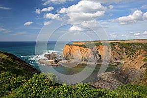 Dramatic and colorful cliffs on Alentejo West Coast in Porto das Barcas, Zambujeira do Mar, Alentejo photo