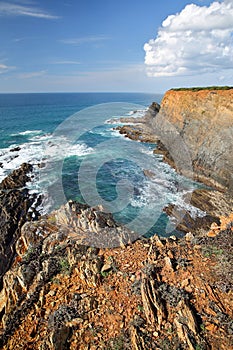 Dramatic and colorful cliffs on Alentejo West Coast in Porto das Barcas, Zambujeira do Mar, Alentejo photo