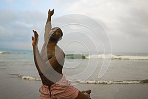 Dramatic contemporary dance choreographer doing ballet beach workout, young attractive and athletic afro black American man