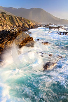 Dramatic Crashing Waves at Sunset on Big Sur coast, Garapata State Park, near Monterey, California, USA photo