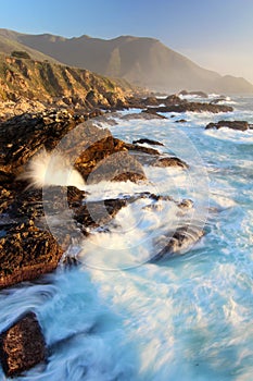 Dramatic Crashing Waves at Sunset on Big Sur coast, Garapata State Park, near Monterey, California, USA photo