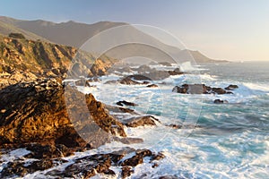 Dramatic Crashing Waves at Sunset on Big Sur coast, Garapata State Park, near Monterey, California, USA photo