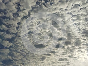 Dramatic cumulus clouds forming under a blue sky