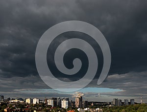 Dramatic dark cloludy sky. A city scape before starting rain