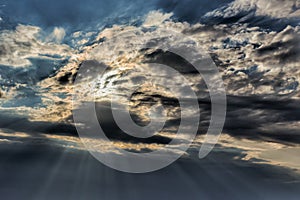 Dramatic Dark Clouds Contrasting with Sunlight