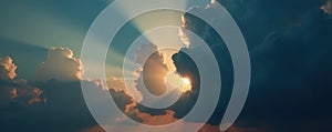 Dramatic, dark cloudscape with rays of sunlight breaking through , abstract, hope
