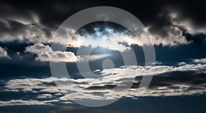 Dramatic Dark Cloudy Sky with Bright Sunlight Breaking Through Thick Clouds