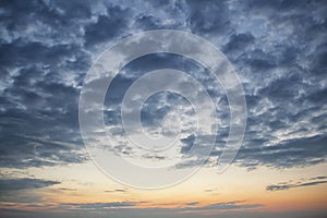 Dramatic dark cloudy sky over sea, natural photo background. Dark storm clouds background