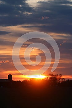 Dramatic dark sky at sunset in countryside