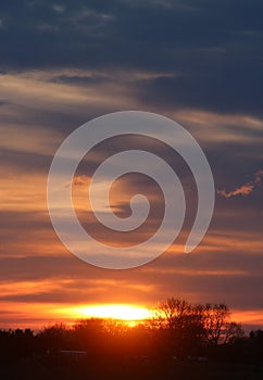 Dramatic dark sky at sunset in countryside