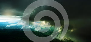 Dramatic dark storm clouds over a green forest