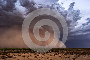 Dramatic dust storm with dark clouds