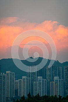 Dramatic evening sky and clouds at sunset over city