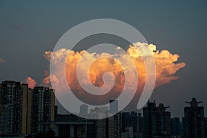 Dramatic evening sky and clouds at sunset over city