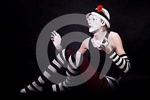 Dramatic funny mime in white hat
