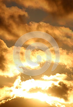 Dramatic golden colors and clouds in sunset sky