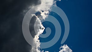 dramatic grey clouds in the sky with sun