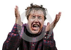 Dramatic isolated portrait of young desperate and stressed man suffering anxiety crisis and depression problem screaming