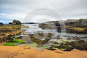 Dramatic landscape of the Ballintoy Harbor shoreline in Northern Ireland