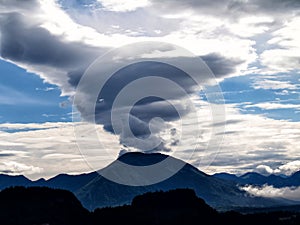 Dramatic lenticular cloud over Alpine peak
