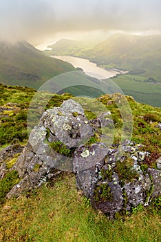 Dramatic Light Breaking Through Low Clouds Over Buttermere From Haystacks Fell In The Lake District, UK.