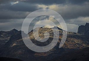 Dramatic light and clouds over mountain peaks of northern norway