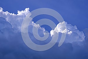 Dramatic light and dark blue Nimbostratus with white Cumulonimbus clouds on blue sky background