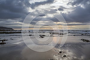 Dramatic low sunshine at Widemouth Bay beach