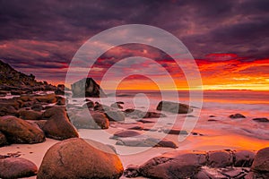 Dramatic midnight sunset with amazing colors over Uttakleiv beach on Lofoten Islands,  Norway