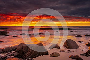 Dramatic midnight sunset with amazing colors over Uttakleiv beach on Lofoten Islands,  Norway