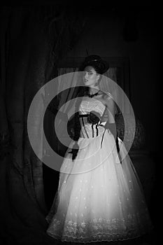 Dramatic monochrome portrait of fantasy bride with hat