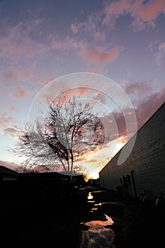 Dramatic moody sunset orange purple yellow boise idaho water reflection alley