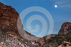 dramatic moon rise landscape taken in Zion national Park in Utah during autumn.