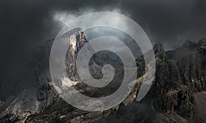 Dramatic mountain landscape in fog and mist - Dolomite Mountains photo