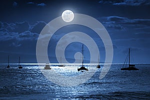 Dramatic Nighttime Ocean Scene With Beautiful Full Blue Moon in Lahaina on the island of Maui, Hawaii