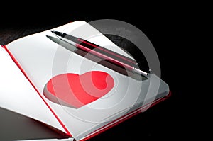 Dramatic notepad page with heart shape