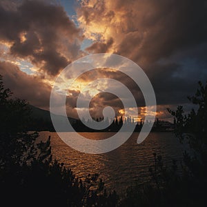 Dramatic overcast sky over Lake Strbske pleso