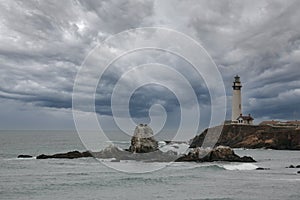 Dramatic Pacific Coast Light House in California With Stormy Clouds