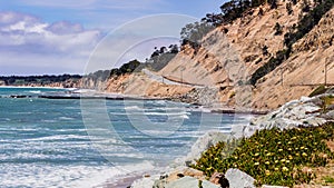 The dramatic Pacific Ocean coastline close to Santa Cruz, California; the scenic Highway 1 and eroded cliffs visible on the right