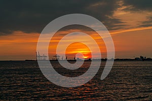 Dramatic panorama evening sky over beautiful port at sunset