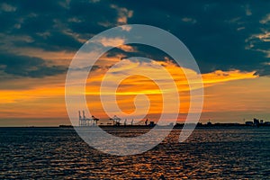 Dramatic panorama evening sky over beautiful port at sunset