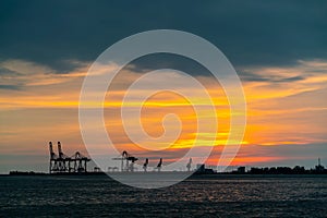 Dramatic panorama evening sky over beautiful port at sunset