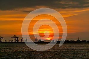 Dramatic panorama evening sky over beautiful port at sunset