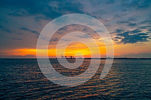 Dramatic panorama evening sky over beautiful port at sunset