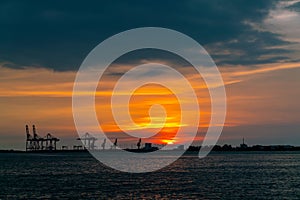 Dramatic panorama evening sky over beautiful port at sunset