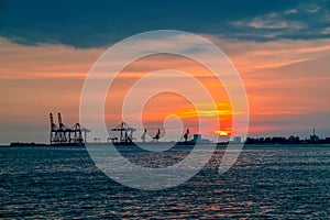 Dramatic panorama evening sky over beautiful port at sunset