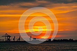 Dramatic panorama evening sky over beautiful port at sunset photo