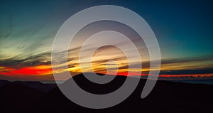 Dramatic panoramic image of the sunset over volcan Calderon Hondo volcano